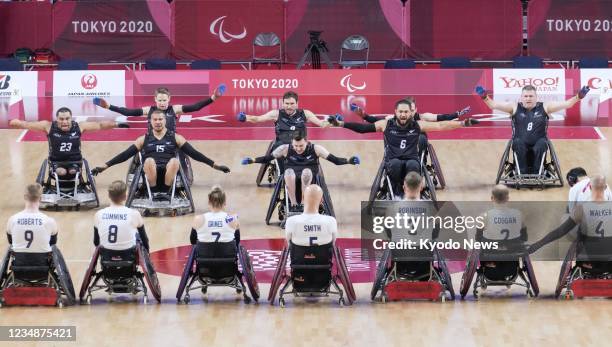 New Zealand players perform the haka ahead of a wheelchair rugby pool phase match against Britain at the Tokyo Paralympics on Aug. 26 at the Yoyogi...