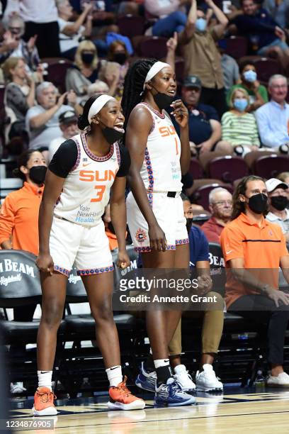 Kaila Charles and Beatrice Mompremier of the Connecticut Sun celebrate during the game against the Las Vegas Aces on August 24, 2021 at the Mohegan...