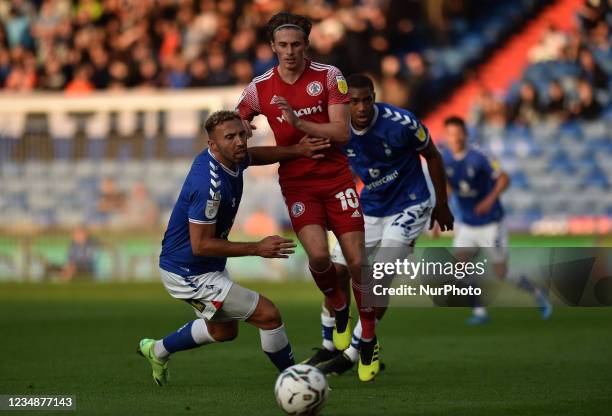 Oldham Athletic's Hallam Hope tussles with Joe Pritchard of Accrington Stanley during the Carabao Cup match between Oldham Athletic and Accrington...