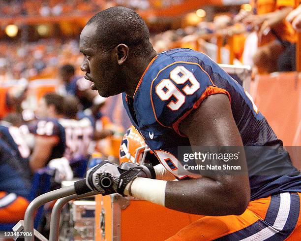 Chandler Jones of the Syracuse Orange stays warm in between plays during the game against the Wake Forest Demon Deacons on September 1, 2011 at the...