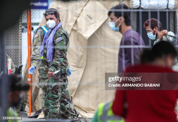 An evacuated Afghan Army member is pictured at the US Air Base Ramstein, Germany on August 26, 2021. - The Ramstein Air Base, the largest US Air...