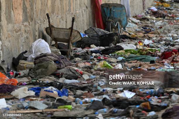 Backpacks and belongings of Afghan people who were waiting to be evacuated are seen at the site of the August 26 twin suicide bombs, which killed...