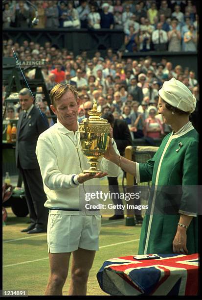 ROD LAVER OF AUSTRALIA RECEIVES THE MENS SINGLES TROPHY ON THE CENTRE COURT AT WIMBLEDON