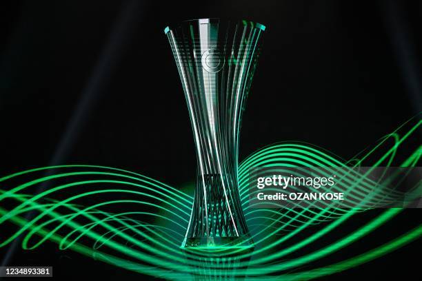 This photograph taken in Istanbul on August 27 shows the UEFA Conference League football trophy displayed on a screen during the ceremony for the...