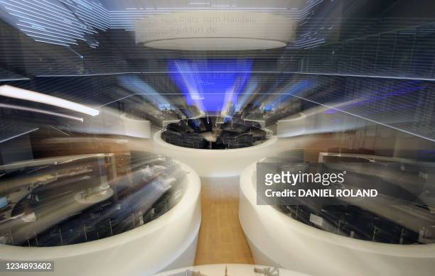 Traders work at the stock exchange in Frankfurt am Main, western Germany, on August 27, 2021. - European stock markets flatlined before a key speech...