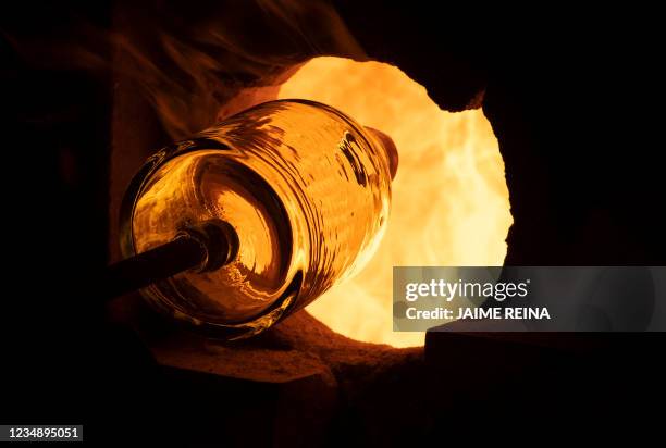 Piece of glass is furnaced at the Vidrios Gordiola glass factory in Algaida on the Spanish island of Mallorca August 27, 2021. The Spanish Government...