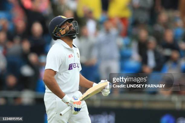India's Rohit Sharma walks off for 59 on the third day of the third cricket Test match between England and India at Headingley cricket ground in...