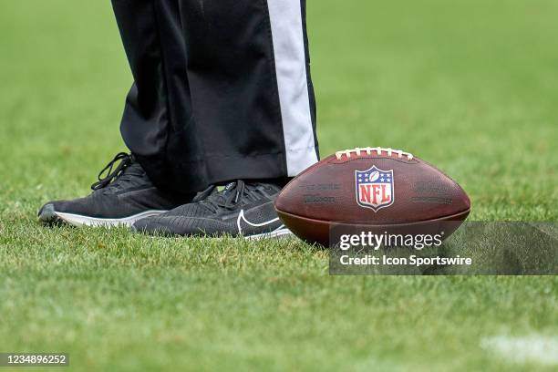 Detail view of the NFL crest logo is seen on a Wilson football resting next to a referee during a preseason game between the Chicago Bears and the...