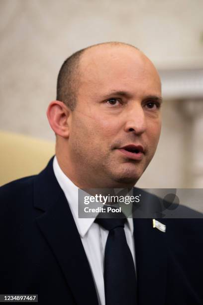 Israeli Prime Minister Naftali Bennett speaks during a meeting with U.S. President Joe Biden in the Oval Office at the White House on August 27, 2021...