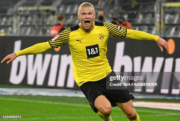 Dortmund's Norwegian forward Erling Braut Haaland celebrates scoring the 3-2 goal during the German first division Bundesliga football match between...