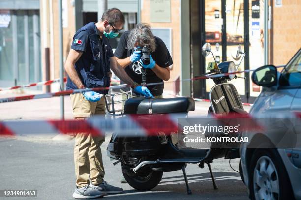 Carabinieri of the forensics police snap photos of the motorcycle of Pasquale Semeraro who was seriously injured in an ambush around 12 o'clock on...