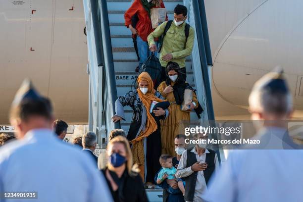 Afghan people disembarking from the last plane with evacuees from Afghanistan in the Military Air Base of Torrejon. Spain has concluded the...