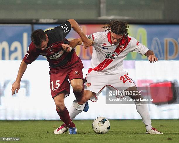 Antonio Marino of Reggina competes for the ball with Federico Gerardi of Grosseto during the Serie B match between Reggina Calcio and US Grosseto FC...