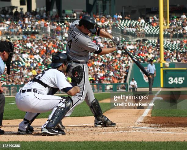 Paul Konerko of the Chicago White Sox swings and makes contact during a MLB game against the Detroit Tigers at Comerica Park on September 3, 2011 in...