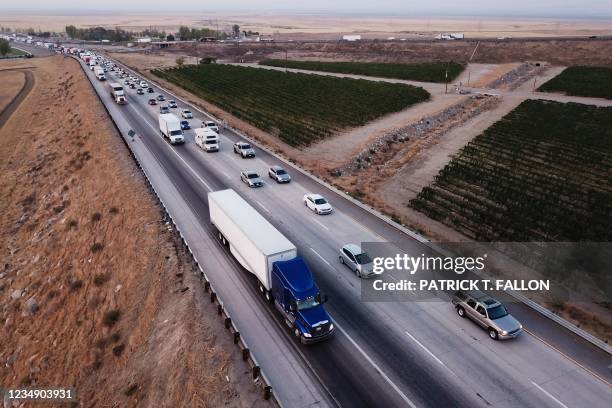 An aerial picture taken on August 26 shows trucks, cars, and other vehicles sitting in traffic due to road construction on Interstate 5 as they...