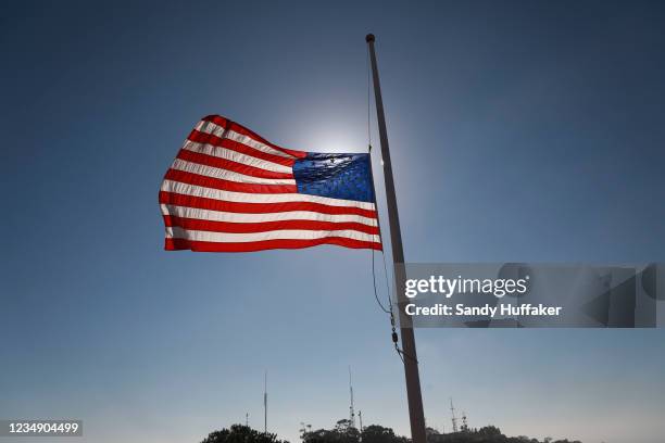 Flag flies at half staff at the Mt. Soledad National War Memorial on August 27, 2021 in La Jolla, California. 170 People were killed, including 13...