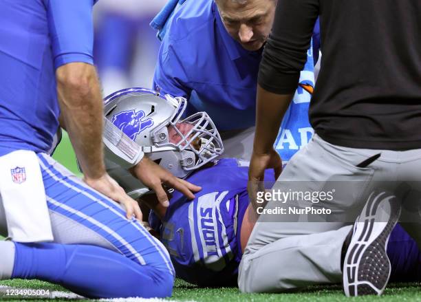 Detroit Lions offensive tackle Dan Skipper is checked after an injury during the first half of an NFL preseason football game between the Detroit...