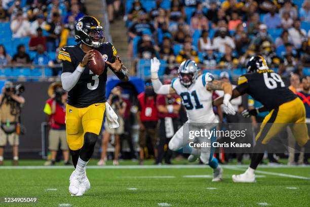 Dwayne Haskins of the Pittsburgh Steelers scrambles out of the pocket against the Carolina Panthers during the first half of an NFL preseason game at...