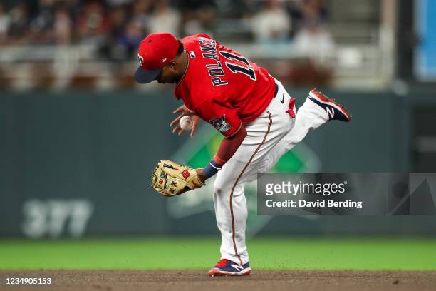 Jorge Polanco of the Minnesota Twins misplays a ball hit by Kolten Wong of the Milwaukee Brewers for an infield single in the third inning of the...