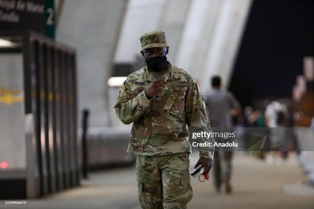 Afghan refugees families evacuated from Kabul arrive in Washington Dulles International Airport
