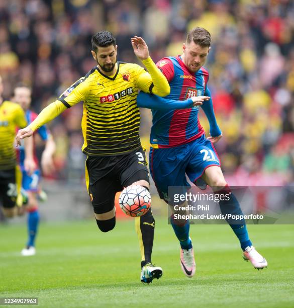 Miguel Britos of Watford and Connor Wickham of Crystal Palace challenge for the ball during the FA Cup Semi Final at Wembley Stadium on April 24,...