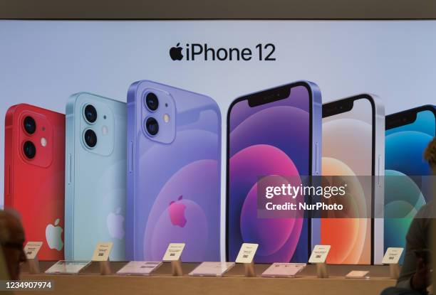 The iPhone 12 advertisment inside an Apple shop. On Tuesday, 17 August 2021, in Edmonton, Alberta, Canada.