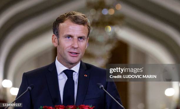 French President Emmanuel Macron speaks during a joint news conference with his Iraqi counterpart after their meeting on August 28, 2021 in Baghdad....