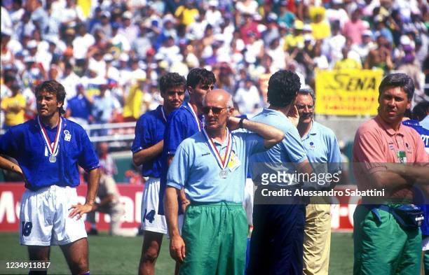 Pierluigi Casiraghi, Arrigo Sacchi head coach and Carlo Ancelotti of Italy shows their dejection after the Final FIFA World Cup 1994 match between...