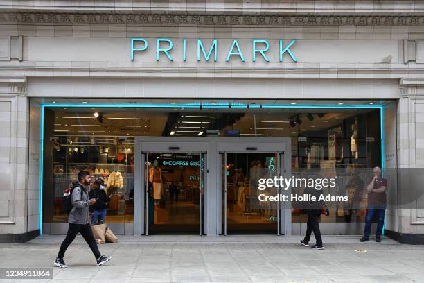 Pedestrian walks past a Primark store on Oxford Street on August 28, 2021 in London, England. Primark is offering Covid vaccinations at some of its...