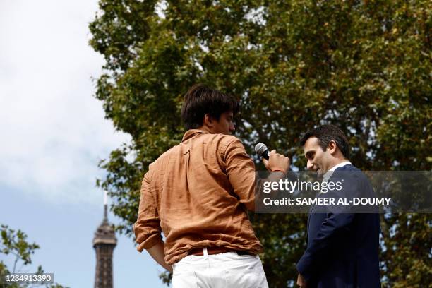 French nationalist party "Les Patriotes" leader Florian Philippot stands on a platform during a rally called by his party against the compulsory...