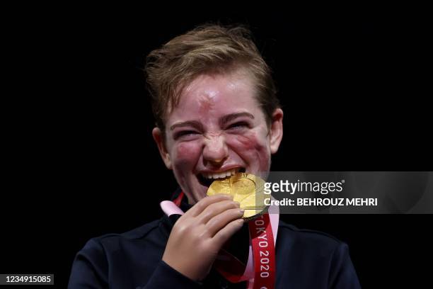 Italy's gold medallist Beatrice Vio celebrates on the podium of the wheelchair fencing women's foil individual category B during the Tokyo 2020...