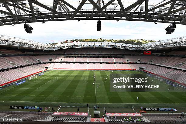 This general view shows players competing without supporters during the French L1 "Huis clos" football match between O.G.C Nice and F.C des Girondins...