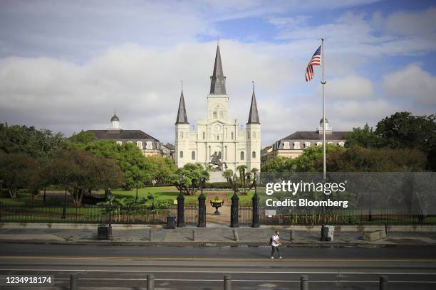An American flag flies outside St. Louis Cathedral at Jackson Square ahead of Hurricane Ida in the French Quarter neighborhood of New Orleans,...