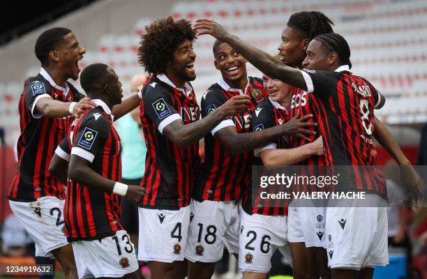 Nice's French midfielder Khephren Thuram celebrates with teammates after scoring a goal during the French L1 football match between Nice and Bordeaux...