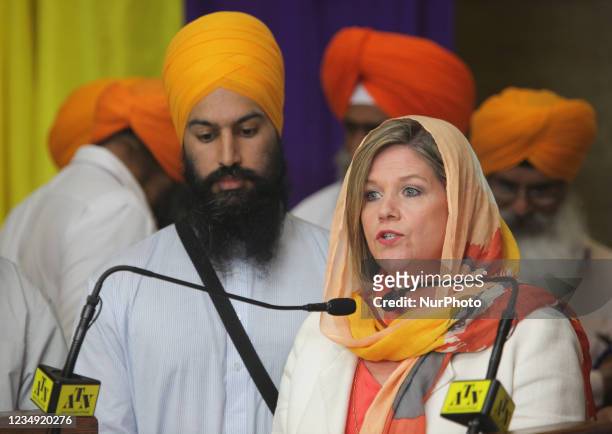 Andrea Horwath, leader of the Ontario New Democratic Party of Canada and party member Jagmeet Singh address members of the Sikh community at the Sri...