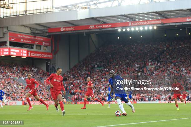 Romelu Lukaku of Chelsea runs at Virgil van Dijk of Liverpool during the Premier League match between Liverpool and Chelsea at Anfield on August 28,...