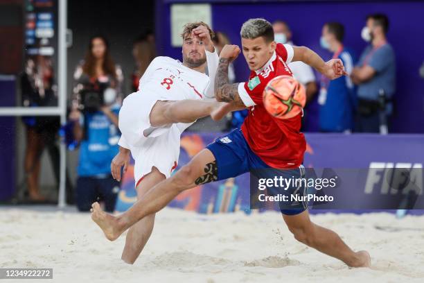 Philipp Borer of Switzerland shoots on goal as Andrei Novikov of Football Union Of Russia defends during the FIFA Beach Soccer World Cup Russia 2021...