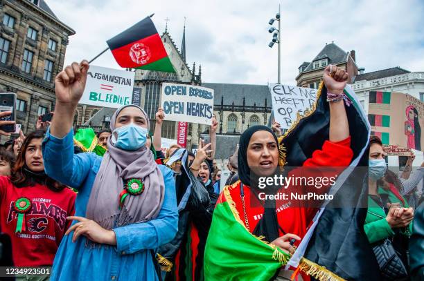 Afghan women are shouting slogans against the Taliban regime, during the demonstration in support of Afghanistan taking place in Amsterdam, on August...