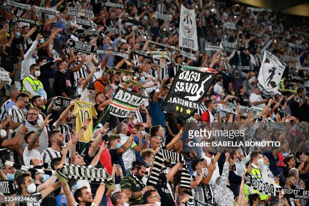 Juventus fans cheer on their team during the Italian Serie A football match Juventus vs Empoli at Allianz Stadium in Turin, on August 28, 2021.