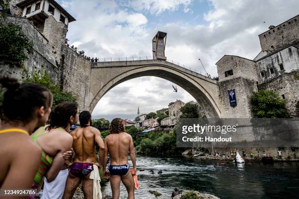 In this handout image provided by Red Bull, Andy Jones of the USA dives from the 27 metre platform on Stari Most during the final competition day of...