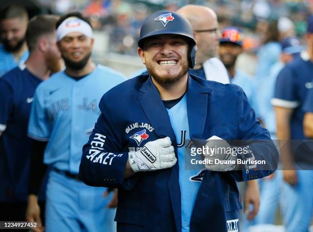 Alejandro Kirk of the Toronto Blue Jays celebrates after hitting a solo home run against the Detroit Tigers during the sixth inning at Comerica Park...