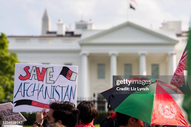 Save Afghanistan" sign is seen in front of the White House during a "Save Afghan Lives" protest on August 28, 2021 in Washington, DC. The protest...