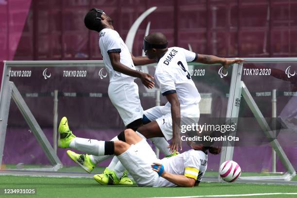 Yvan Wouandji Kepmegni, Ahmed Tidiane Diakite and Frederic Villeroux of Team France during the Football 5-a-side Preliminary Round Group A match...