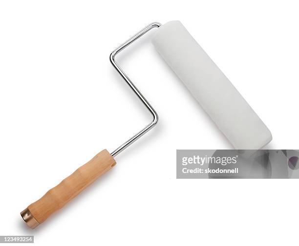 new paint roller on white - paint roller stock pictures, royalty-free photos & images