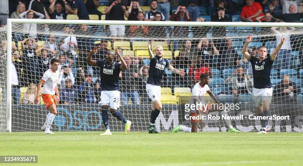 Millwall's Benik Afobe after going close and Scott Malone and Matt Smith appeal for a corner during the Sky Bet Championship match between Millwall...
