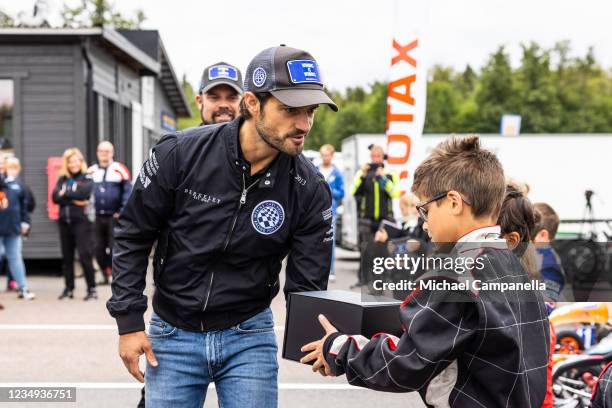 Prince Carl Philip of Sweden gives out prizes to the 7-10 year old Cadetti class during the Prince Carl Philip Racing Trophy at GTR Motorpark on...