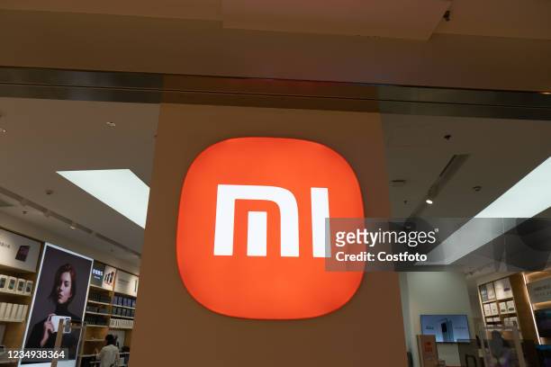 Customers experience Xiaomi products at the mi Home flagship store in Shanghai, East China, Aug. 28, 2021.