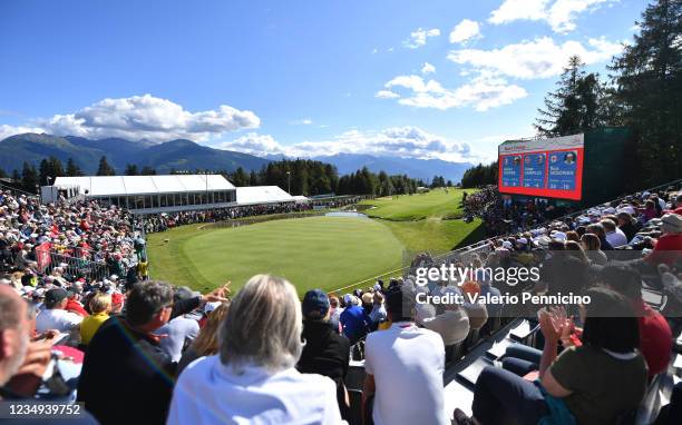 Spectators watch the play at the 18th green during Day Four of The Omega European Masters at Crans-sur-Sierre Golf Club on August 29, 2021 in...