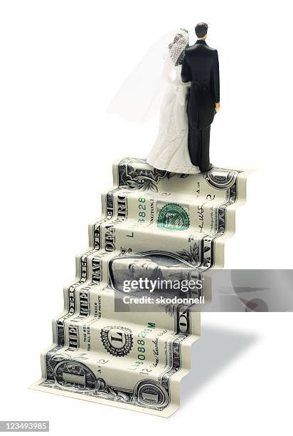 marriage and finances - wedding cake figurine stock pictures, royalty-free photos & images