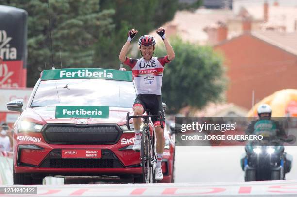 Team UAE Emirates' Polish rider Rafal Majka celebrates as he wins the 15th stage of the 2021 La Vuelta cycling tour of Spain, a 197.5 km race from...